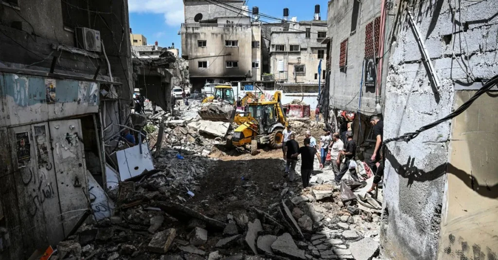 Today Israel Hamas News Live Updates : People inspect damage after a raid by Israeli forces in the Nur Shams refugee camp in the occupied West Bank on April 21